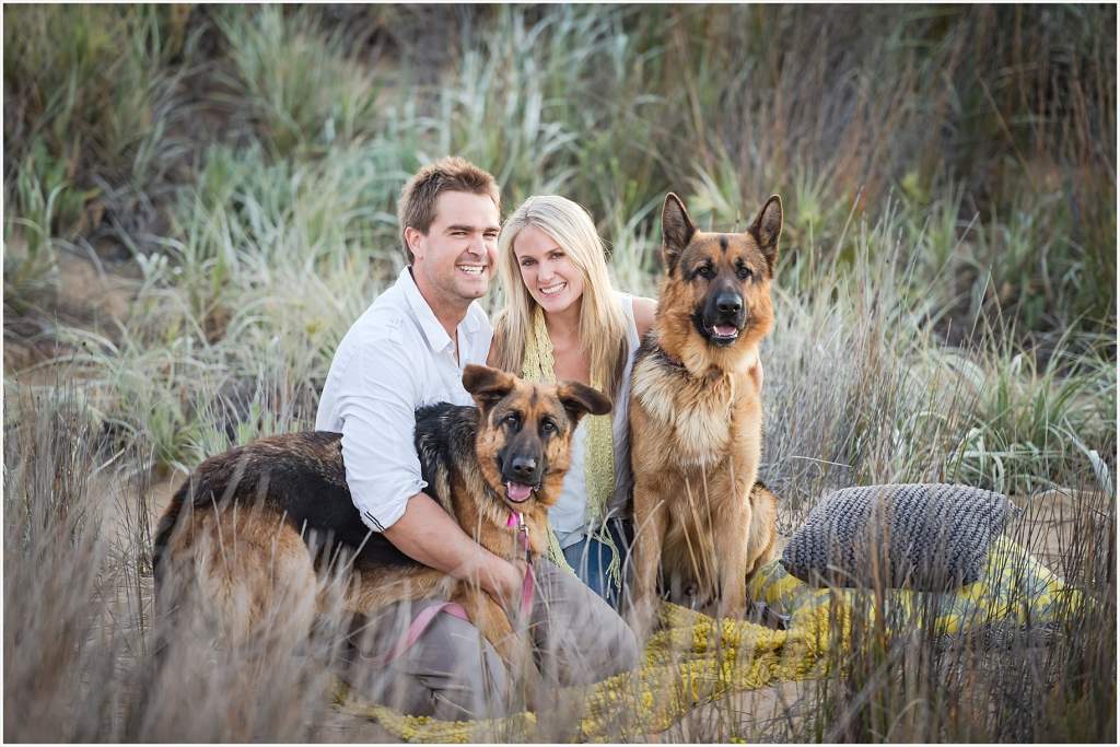 beach love fun engagement pictures with dogs