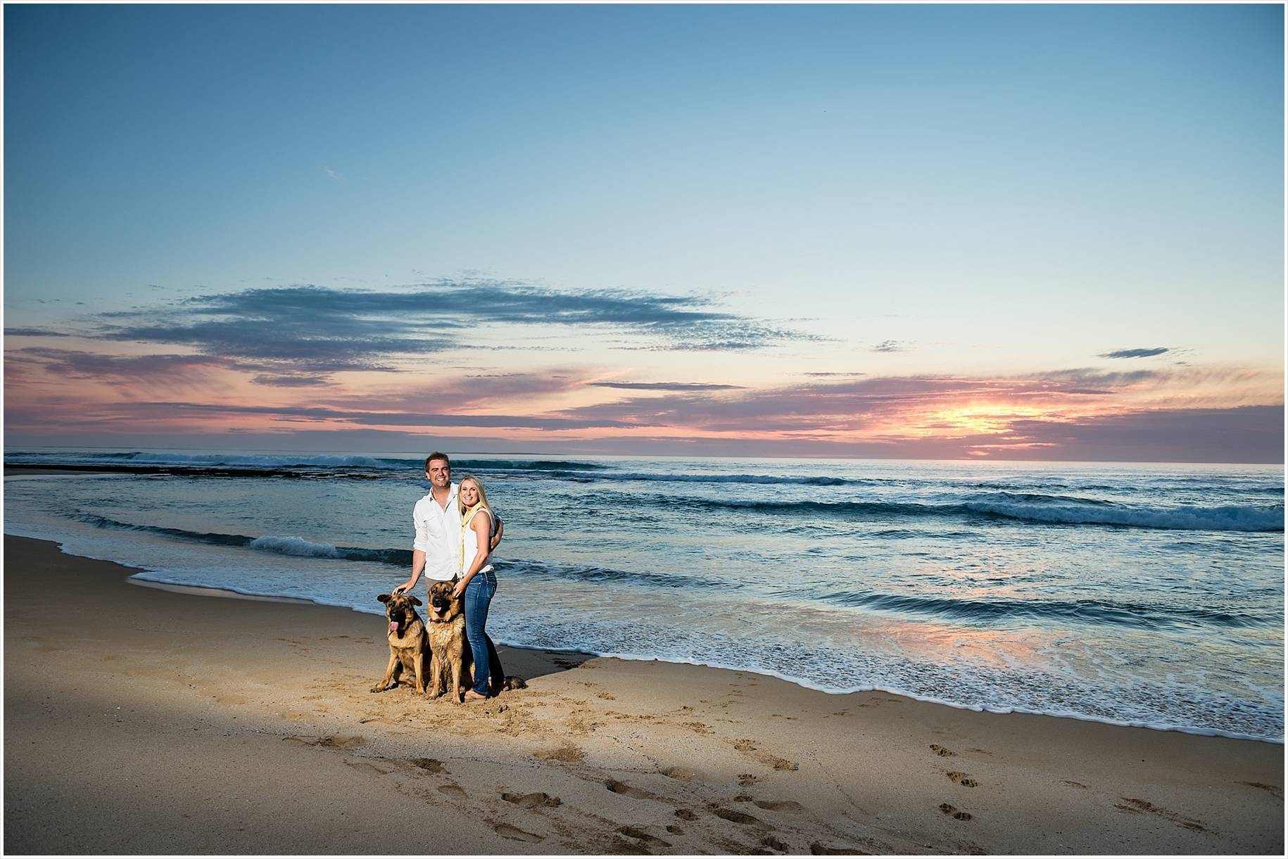 beach love fun engagement pictures with dogs