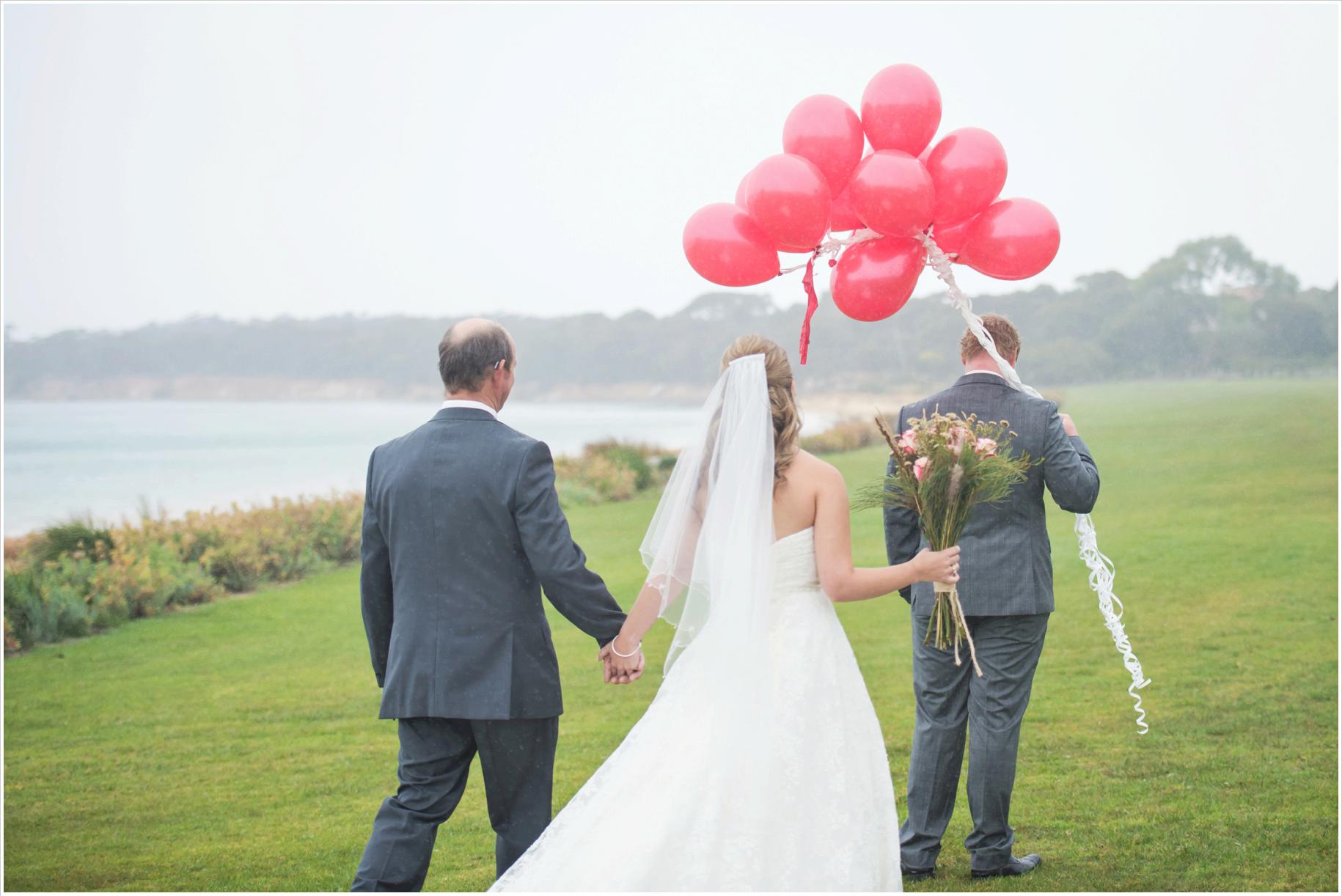 first look in the rain with red balloons