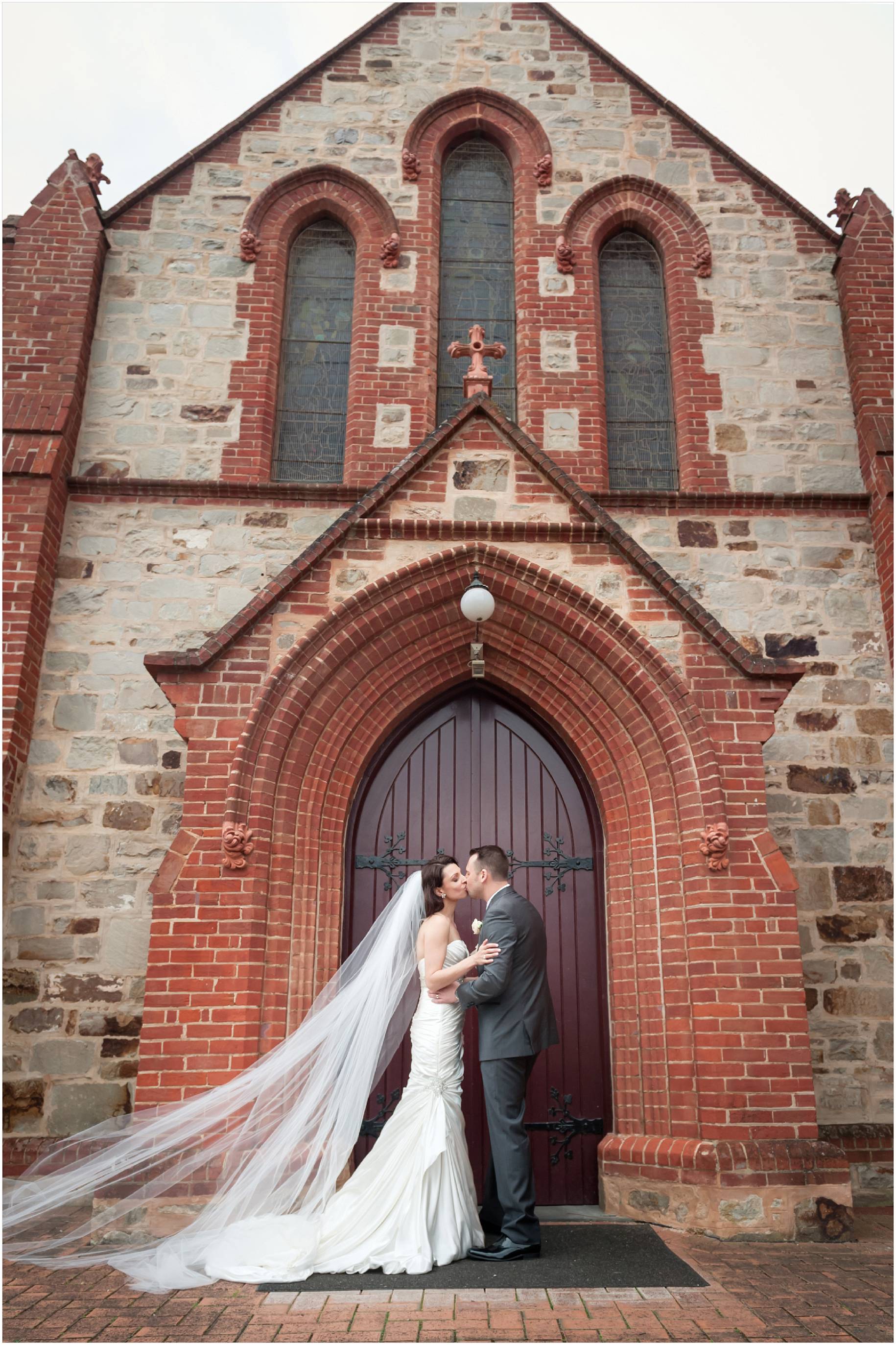 bride and groom infront of church